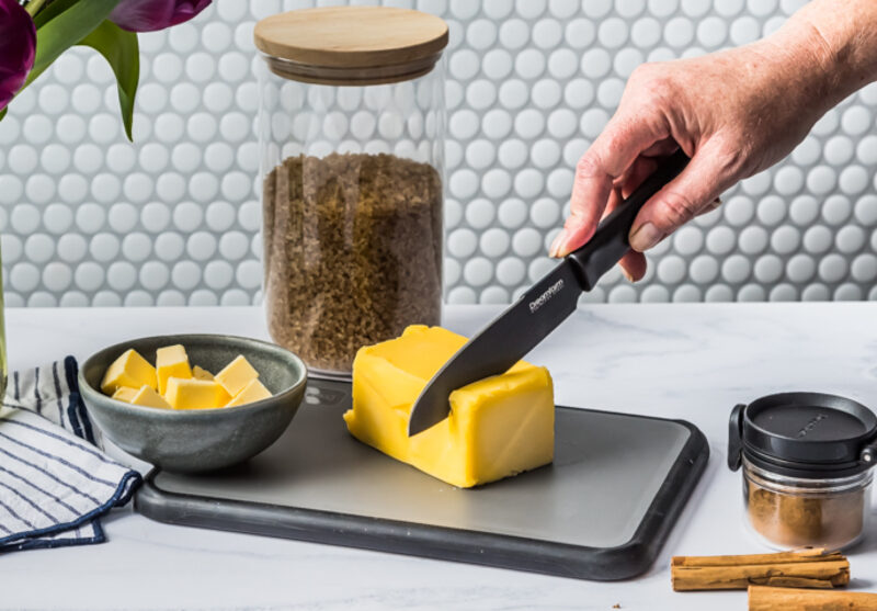 Non-slip cutting board with flip up edges